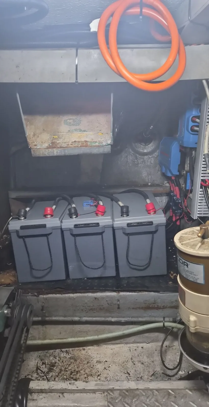 Lithium house battery bank retrofit — three 200Ah lithium batteries installed in the engine bay
