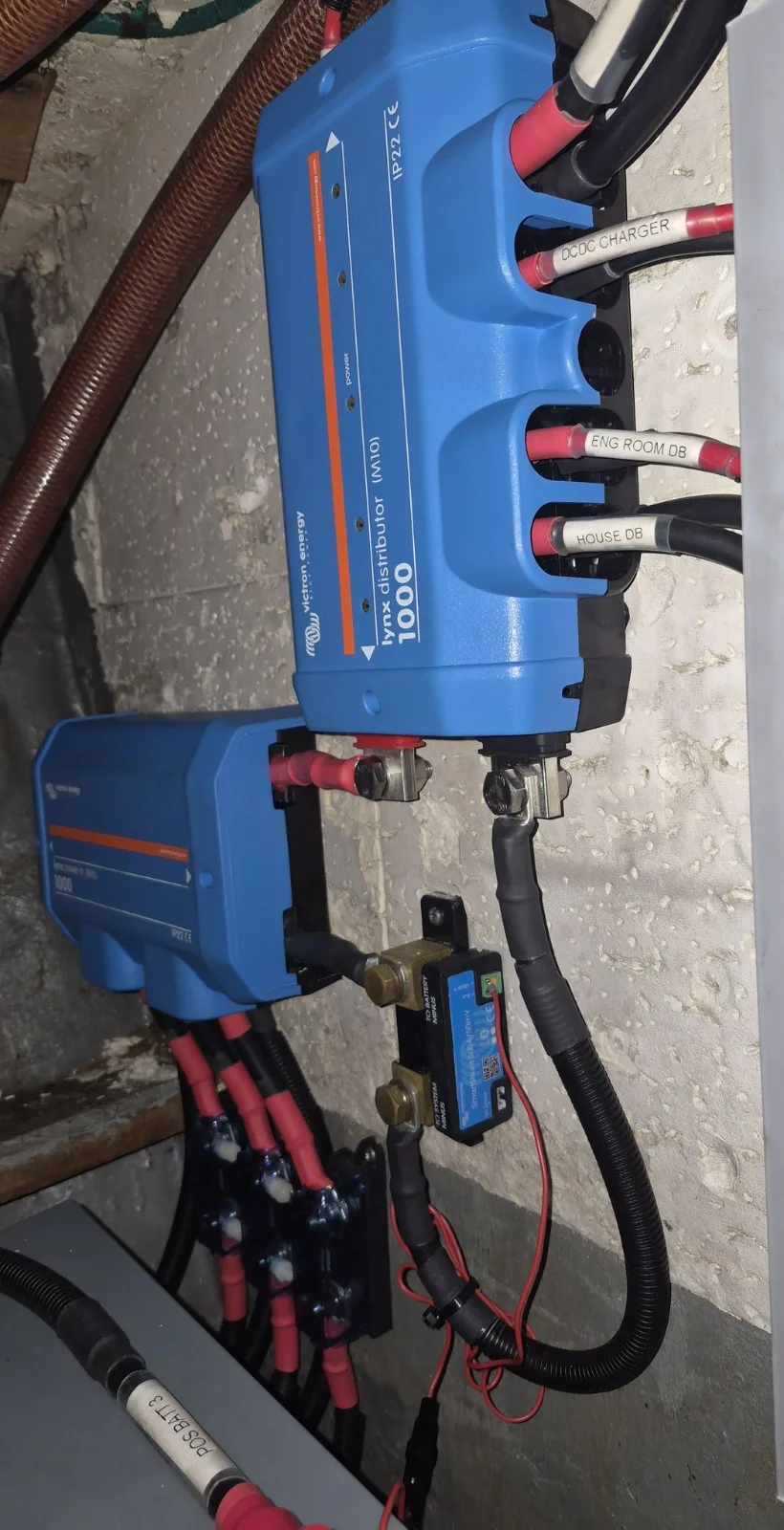 Victron charging equipment neatly mounted and wired as part of a lithium house bank retrofit