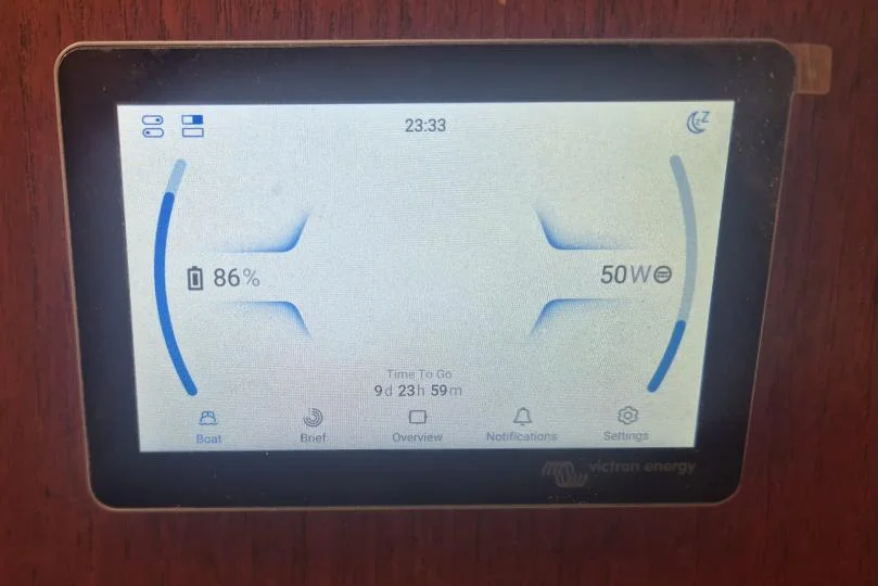 Victron GX Touch display showing house battery state of charge and time to go on a yacht