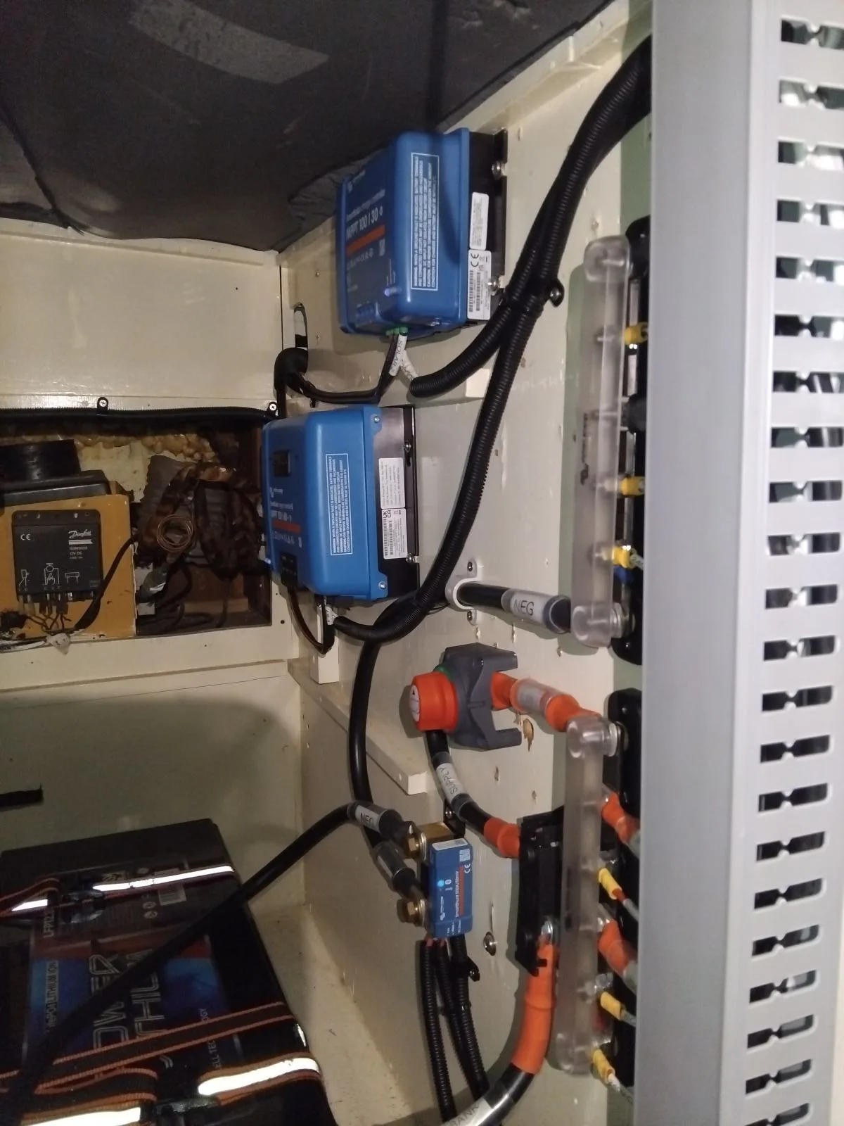 Victron solar charge controllers, fusing and cabling installed in the electrical cabinet