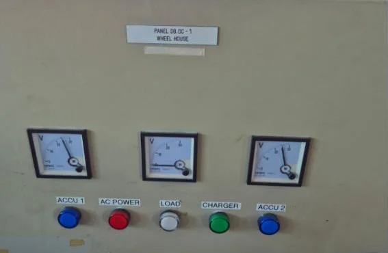 Wheelhouse DC distribution panel with battery voltmeters and status lamps on a commercial vessel